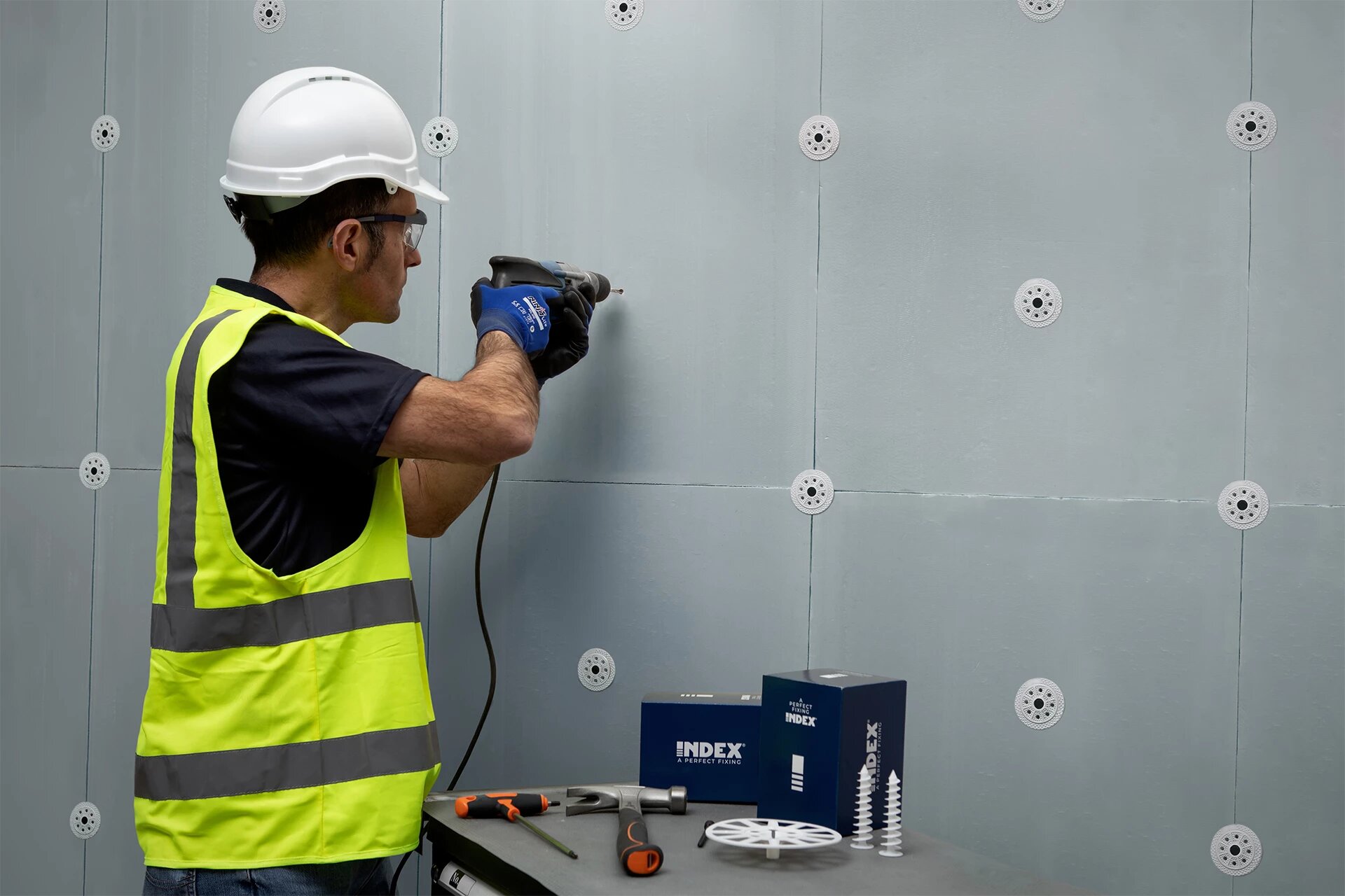 technician installing exterior thermal insulation composite system