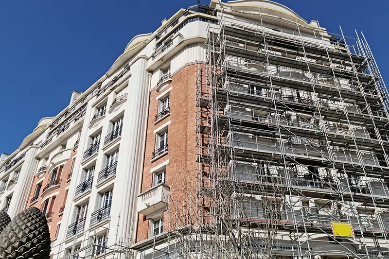 Building with scaffolding for restoration of façade